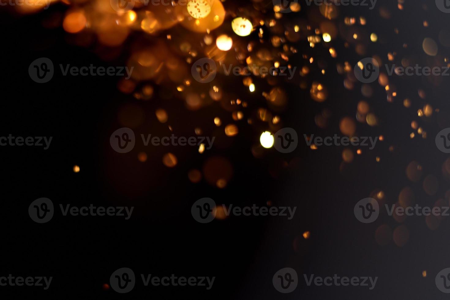 Golden glitter bokeh lighting texture Blurred abstract background for birthday, anniversary, wedding, new year eve or Christmas photo