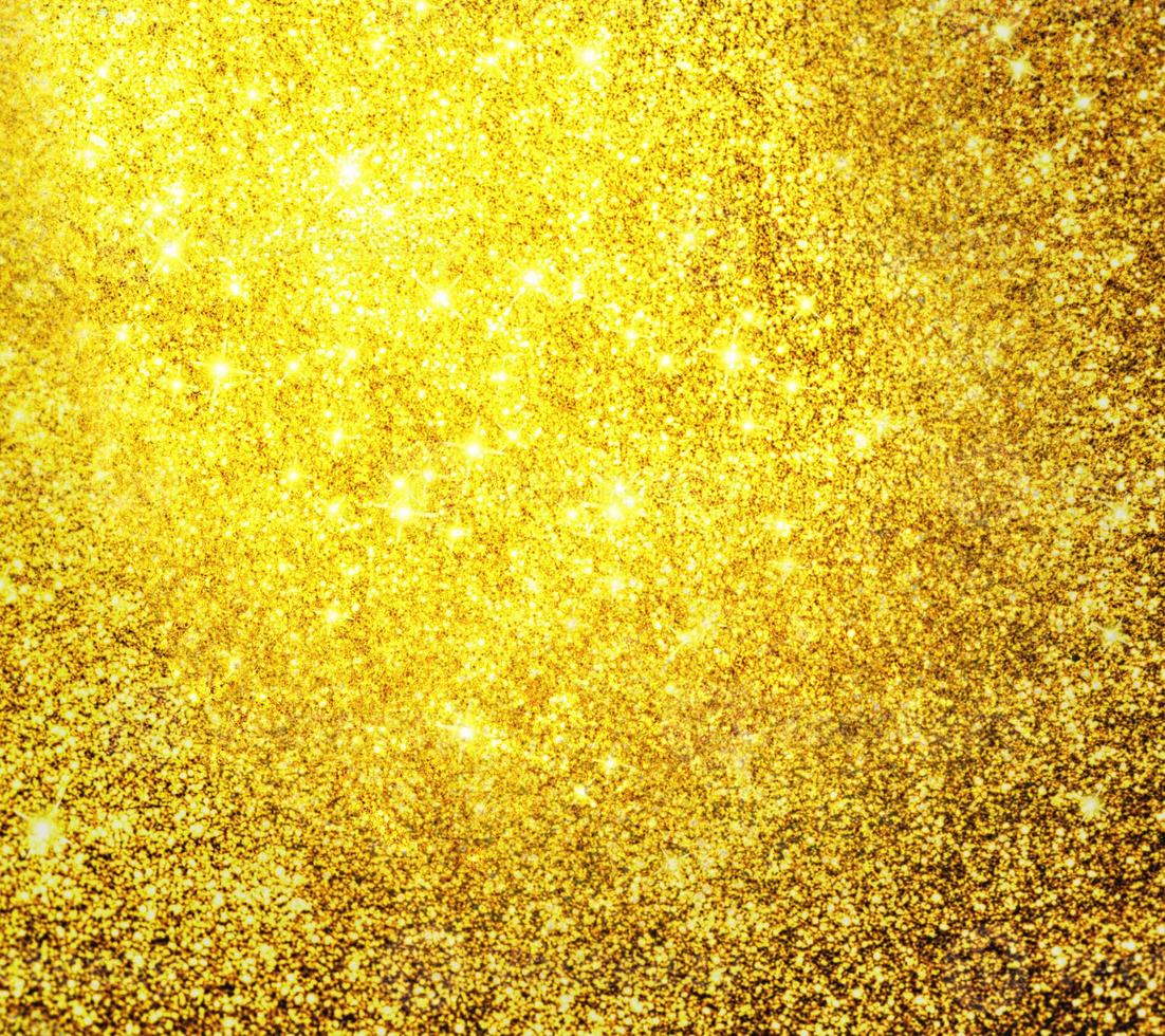 Golden glitter bokeh lighting texture Blurred abstract background for birthday, anniversary, wedding, new year eve or Christmas photo