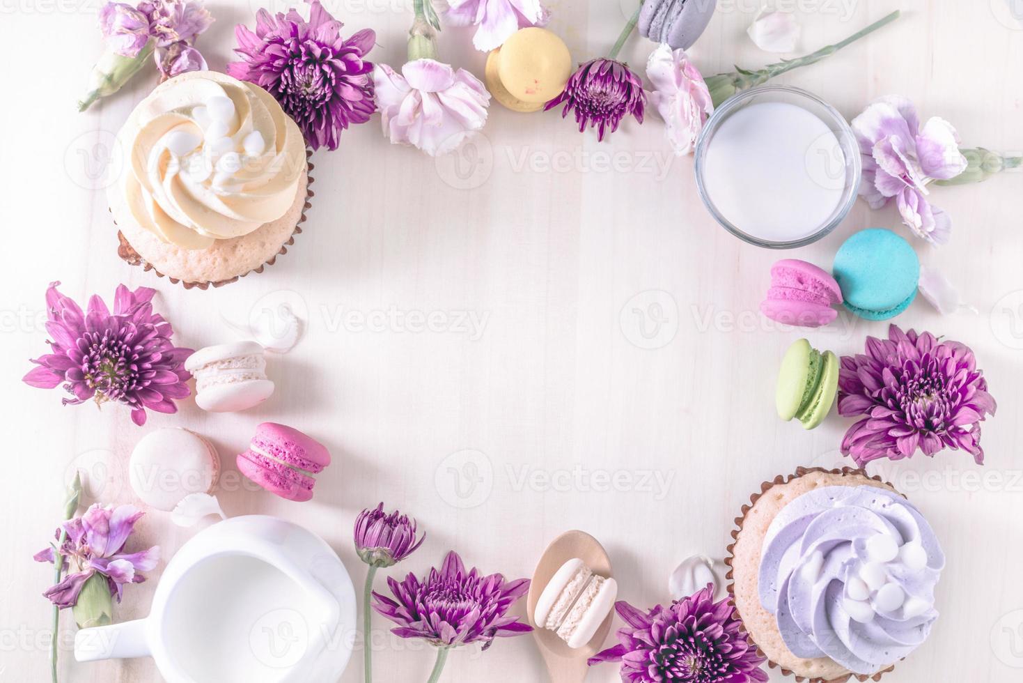 macarons or macaroons and cupcakes with milk on a vintage pastel color dessert sweet beautiful to eat photo