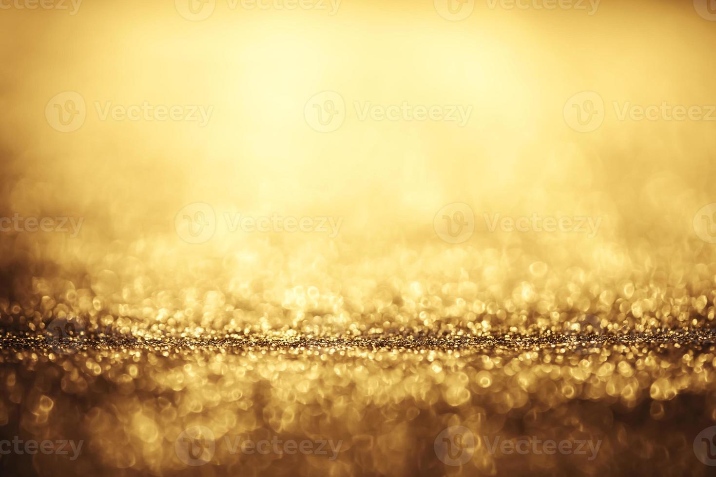 Golden glitter bokeh lighting texture Blurred abstract background for birthday, anniversary, wedding, new year eve or Christmas photo