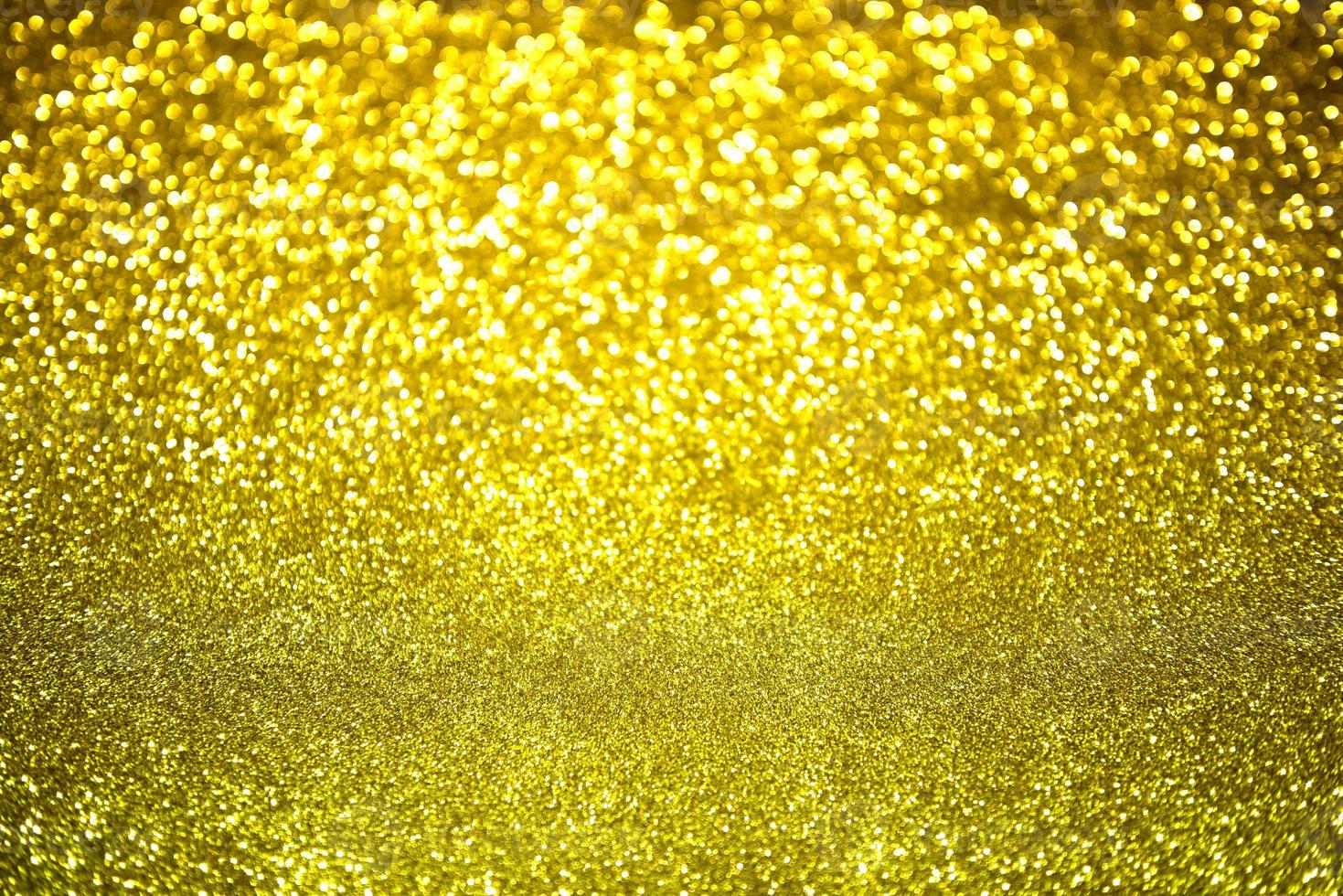 Golden glitter bokeh lighting texture Blurred abstract background for birthday, anniversary, wedding, new year eve or Christmas photo