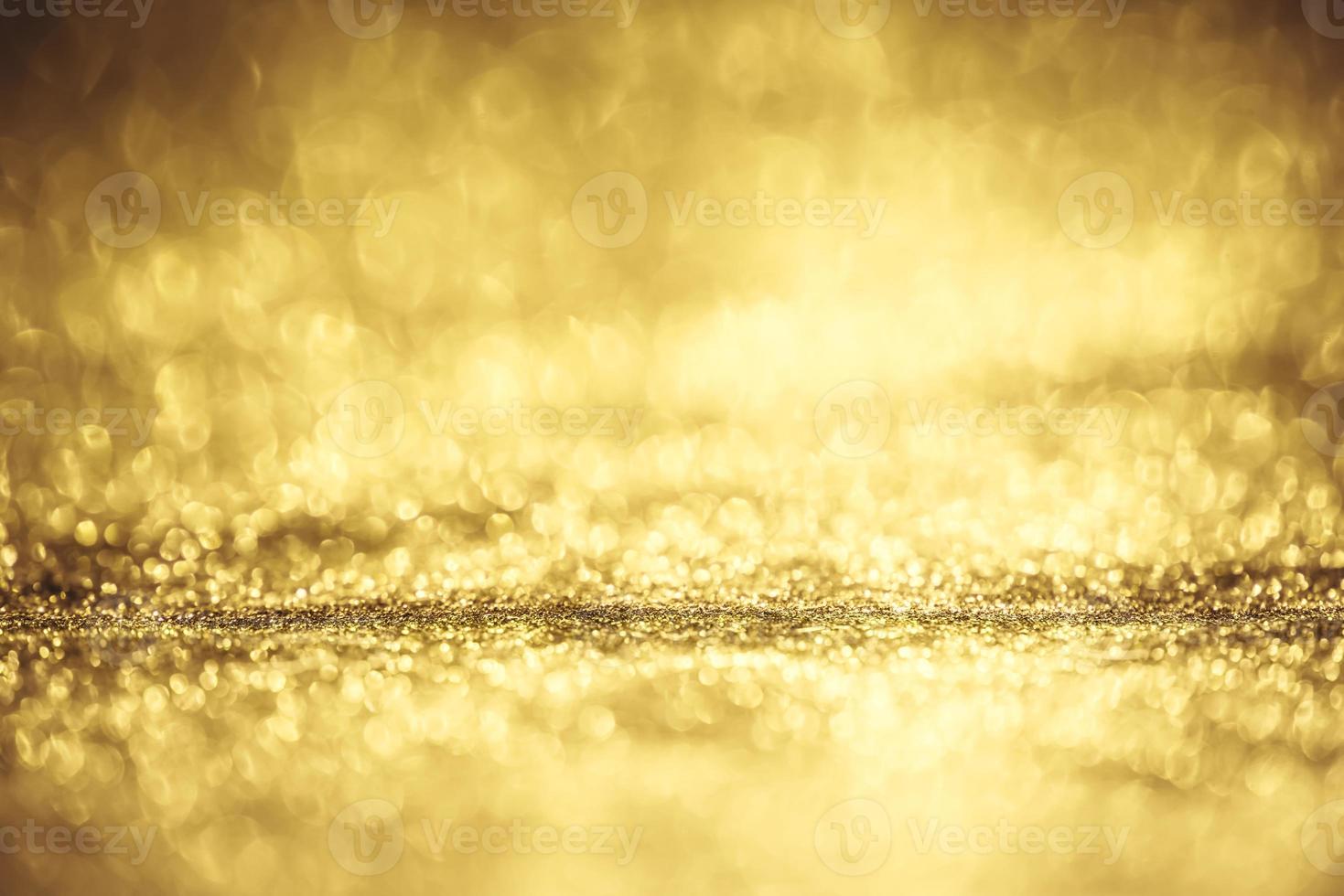 Golden glitter bokeh lighting texture Blurred abstract background for birthday, anniversary, wedding, new year eve or Christmas photo