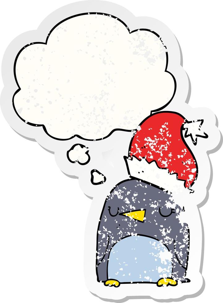 cute christmas penguin and thought bubble as a distressed worn sticker vector