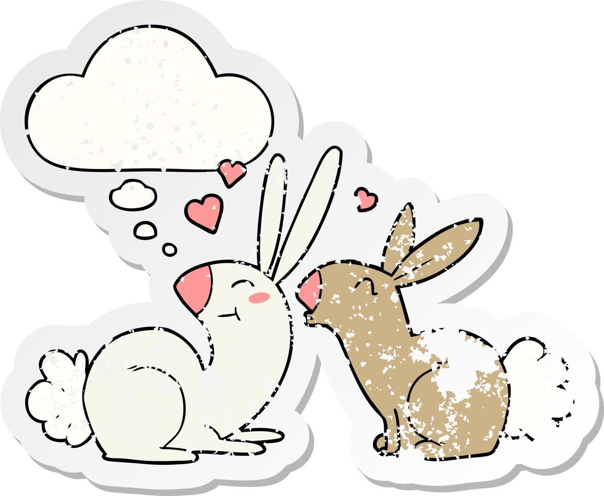 cartoon rabbits in love and thought bubble as a distressed worn sticker vector