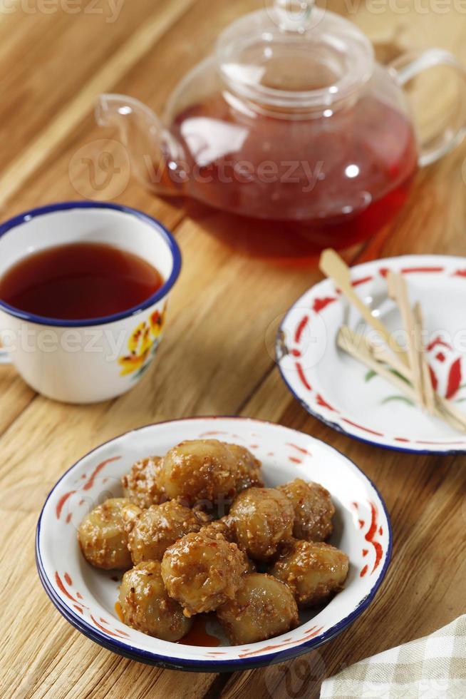 Cilok is Aci Dicolok, Traditional Street Food from West Java, Made from Tapioca or Aci Flour. Cilok is a Round Shaped Snack with a Chewy Texture photo