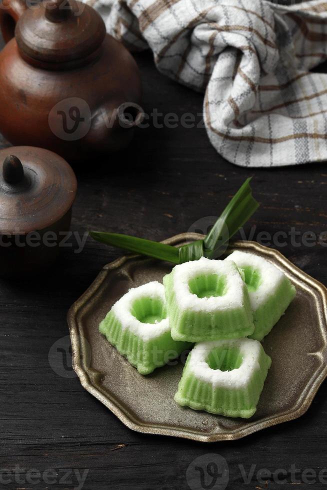 Kue Putu Ayu, Indonesian Traditional Jajan pasar made from Steamed Flour and Grated Coconut. Served with Tea photo