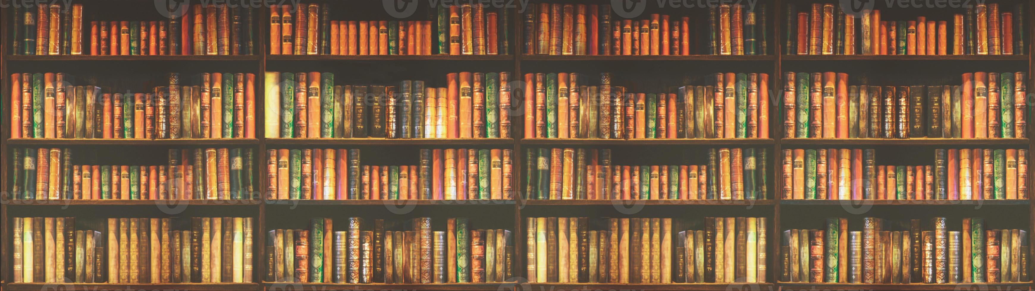 panorama blurred bookshelf Many old books in a book shop or library. photo