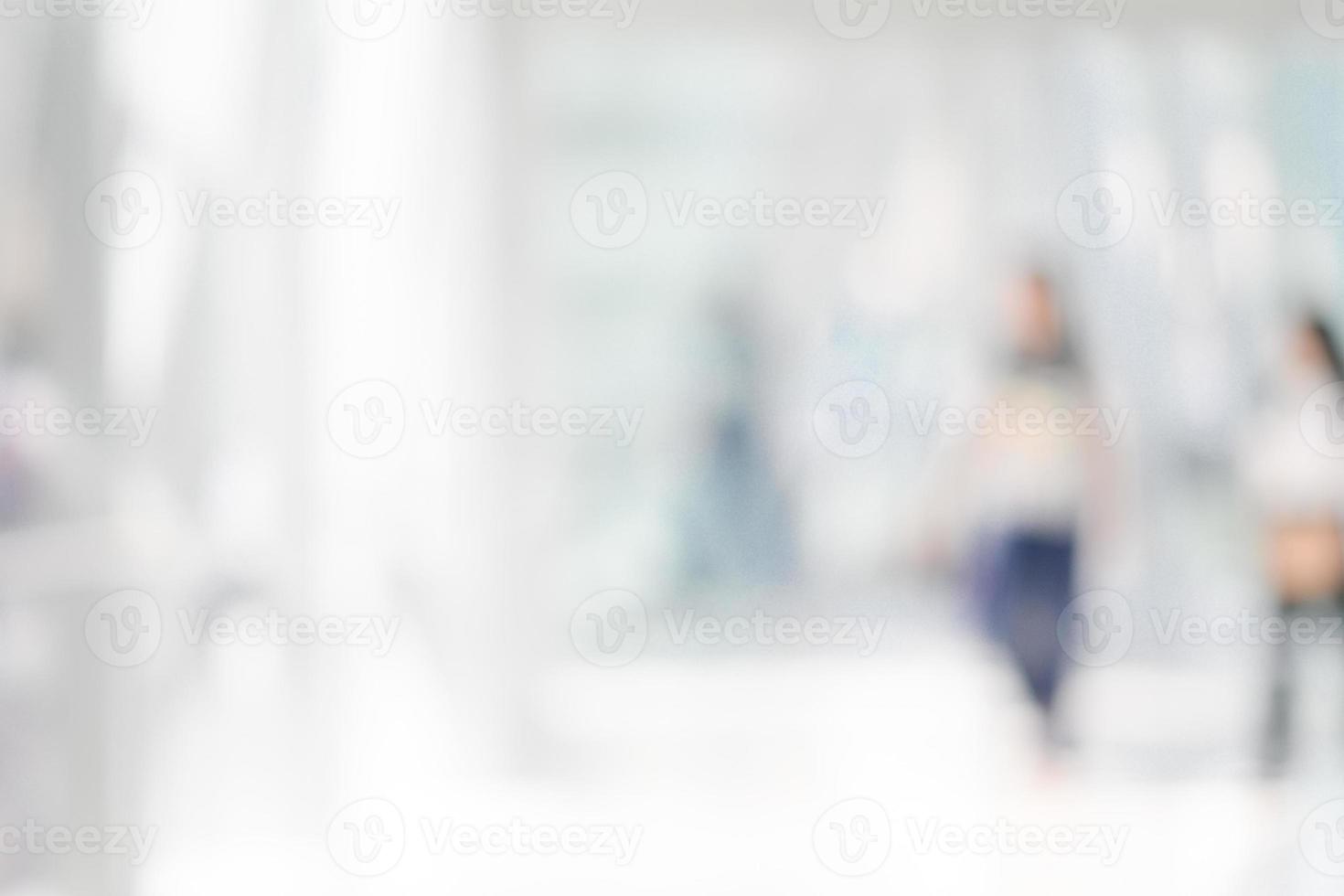 Blurred people walking in a modern environment photo