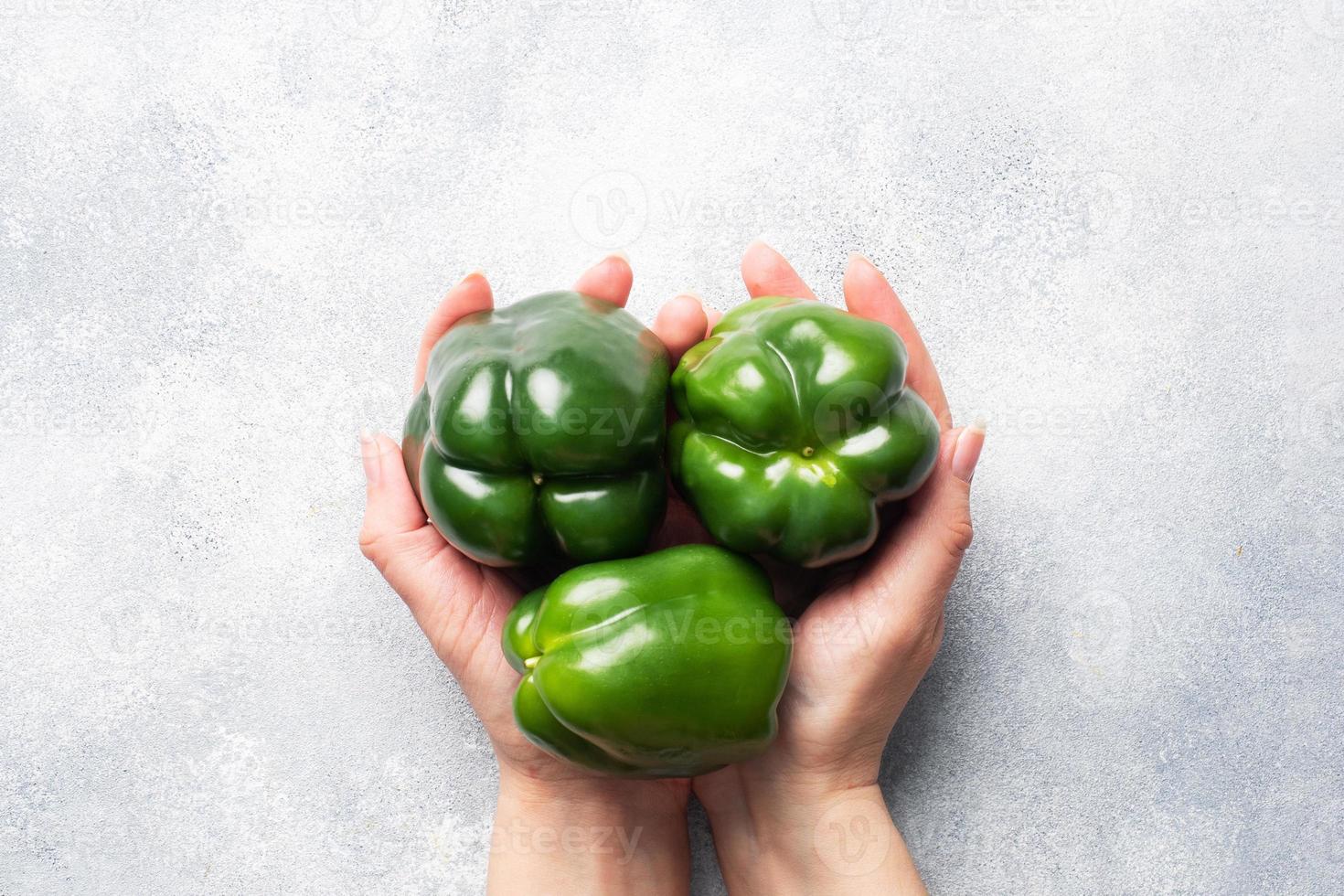 Fresh sweet green pepper on a grey concrete background. Copy space. photo