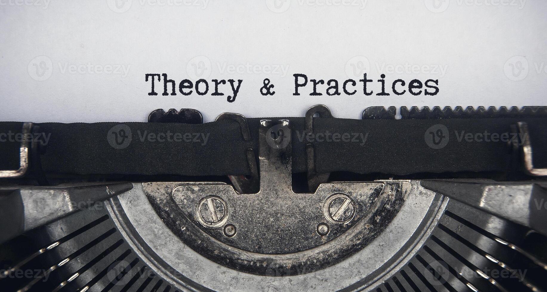 Theory and practices text typed on an old vintage typewriter. Conceptual photo