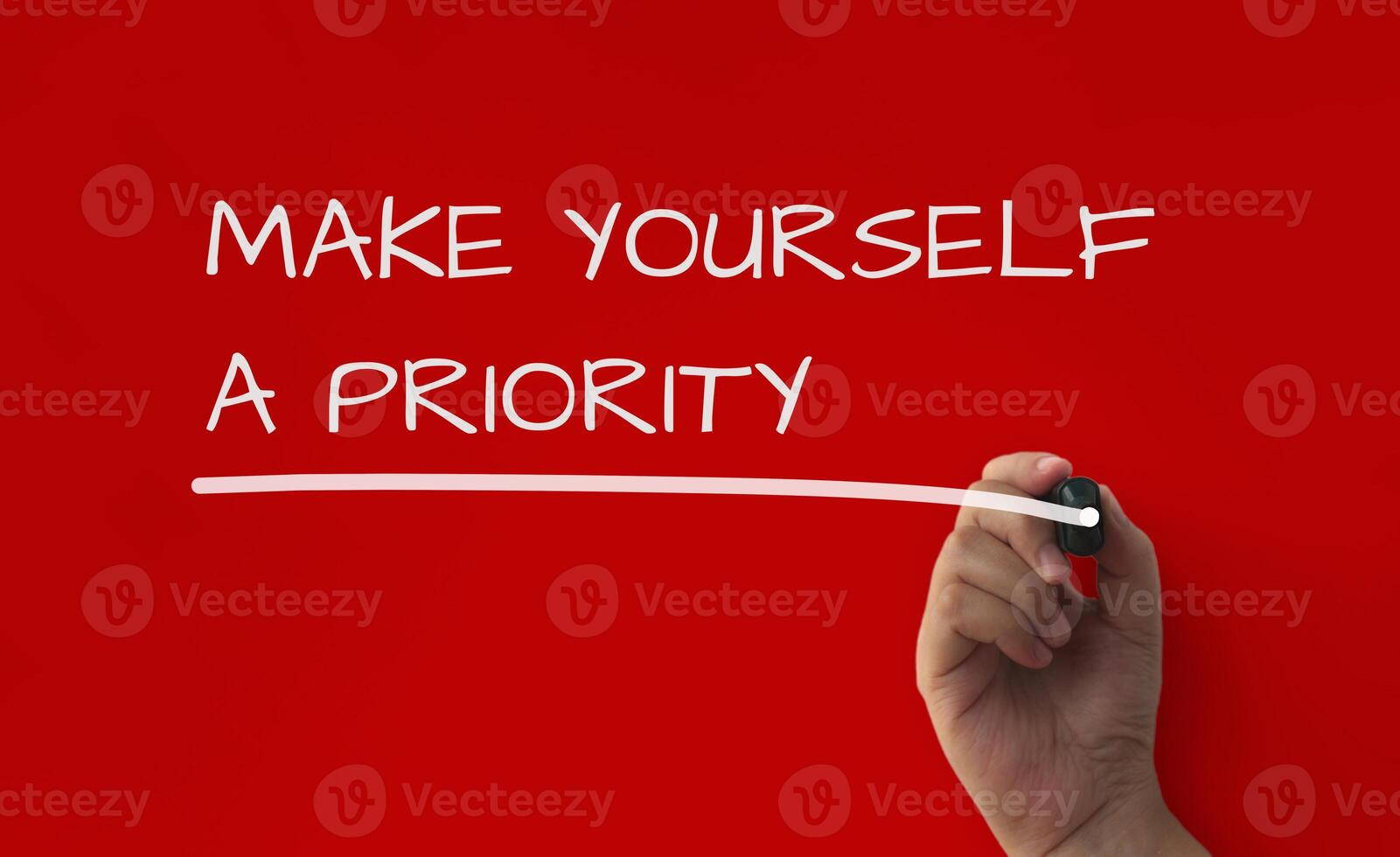 Inspirational quote text on red cover background - Make yourself a priority. photo