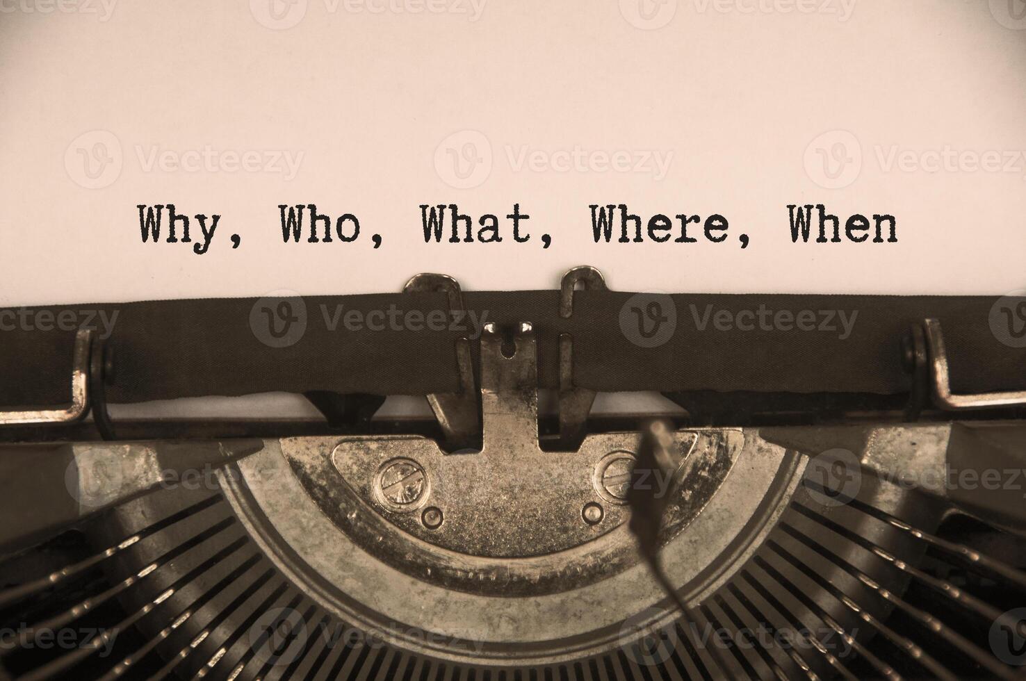 Why, who, what, where and when text on an old typewriter. photo