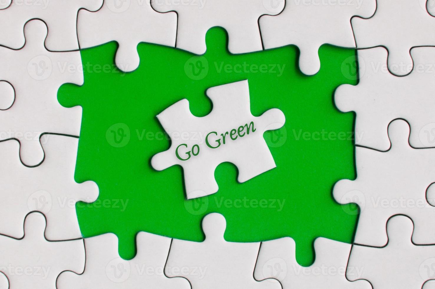 Go green text on jigsaw puzzle. Nature Concept photo