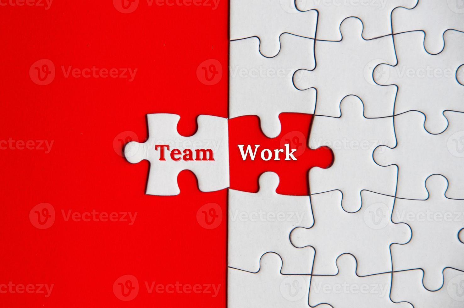 Text on missing jigsaw puzzle - Team Work. Team concept photo