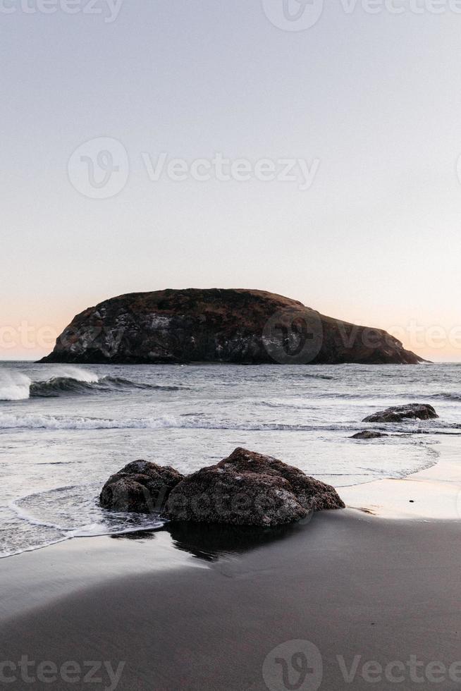 Rock formations in the ocean photo