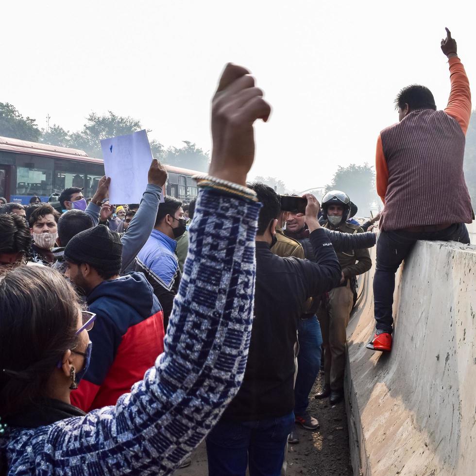 New Delhi, India December 25 2021 - Delhi Contractual Guest Teachers with posters, flags and graffitis protesting against Delhi AAP Government for making policy, Delhi Guest Teachers protesting photo
