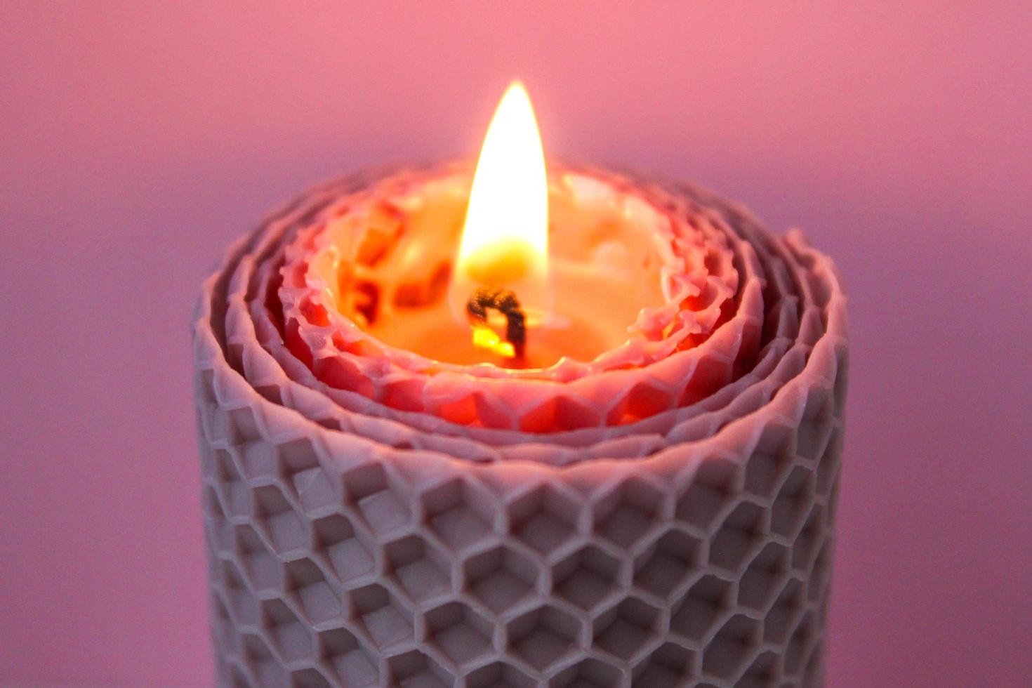 Close up burning wax candle on pink background. 8977478 Stock Photo at
