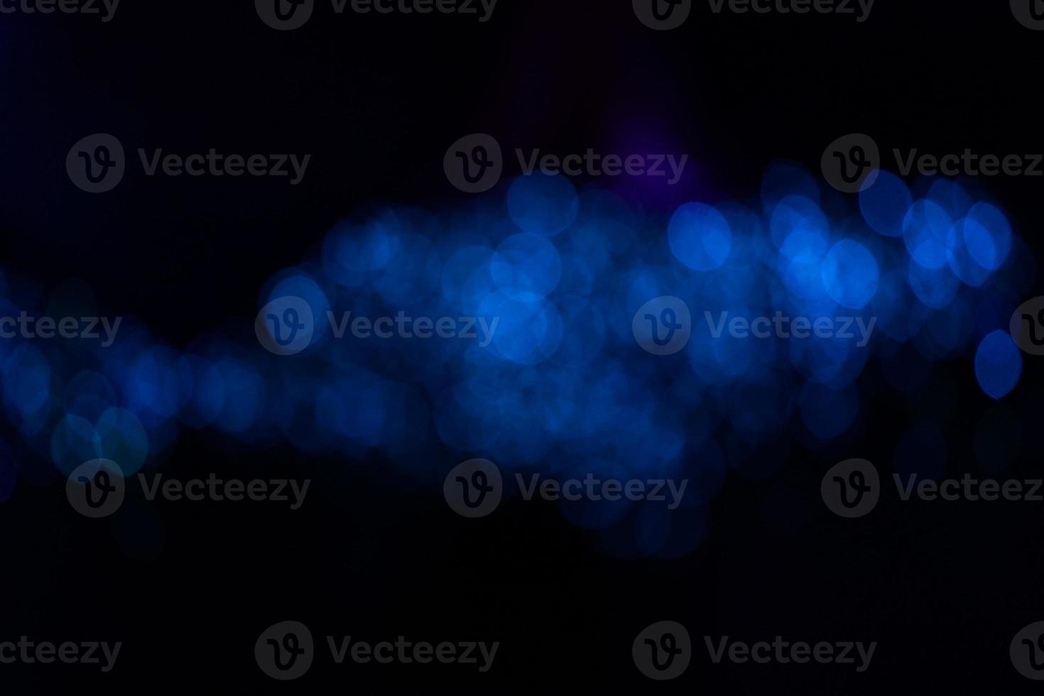 Fantastic blurry and bokeh dark blue theme background in the mystry cave. photo