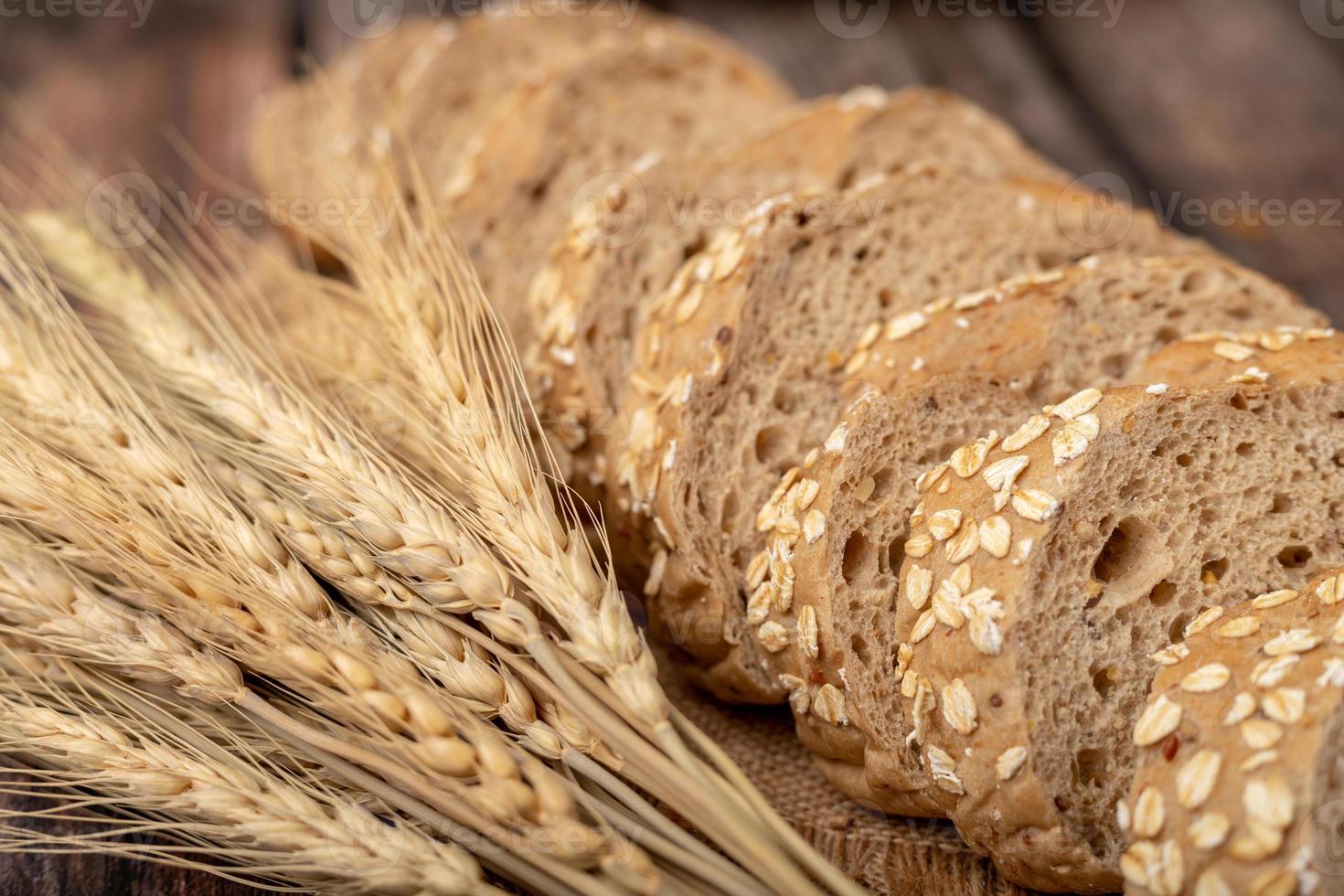 breads sliced and wheatgrass on the sack photo