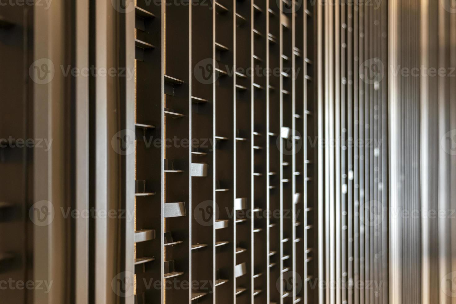 Random battens steel and pole are set in front of hotel wallpaper for backdrop and background. photo