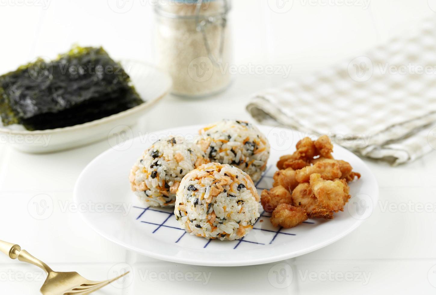 Korean Seaweed Rice Balls or Jumeokbap with Ham, Sausage, Sesame Seed, Sesame Oil, and Stir Fry Carrots photo