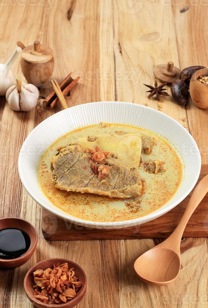 Kari or Gulai Iga Kambing or is Indonesia Traditional Mutton Ribs Curry Soup photo