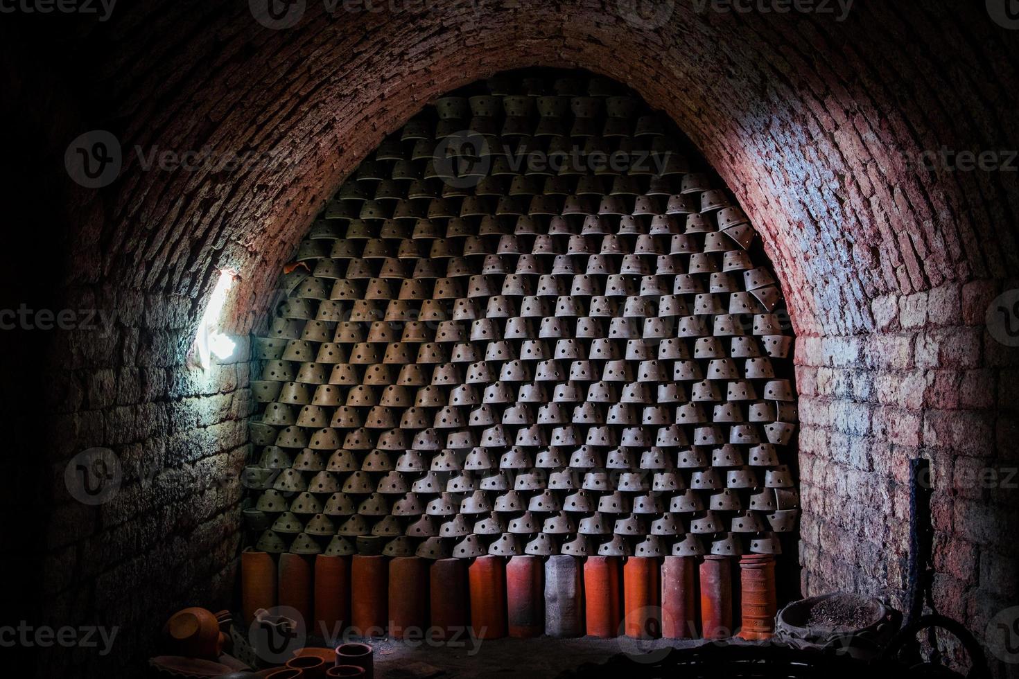 Inside the kiln pottery arranged in an orderly fashion photo