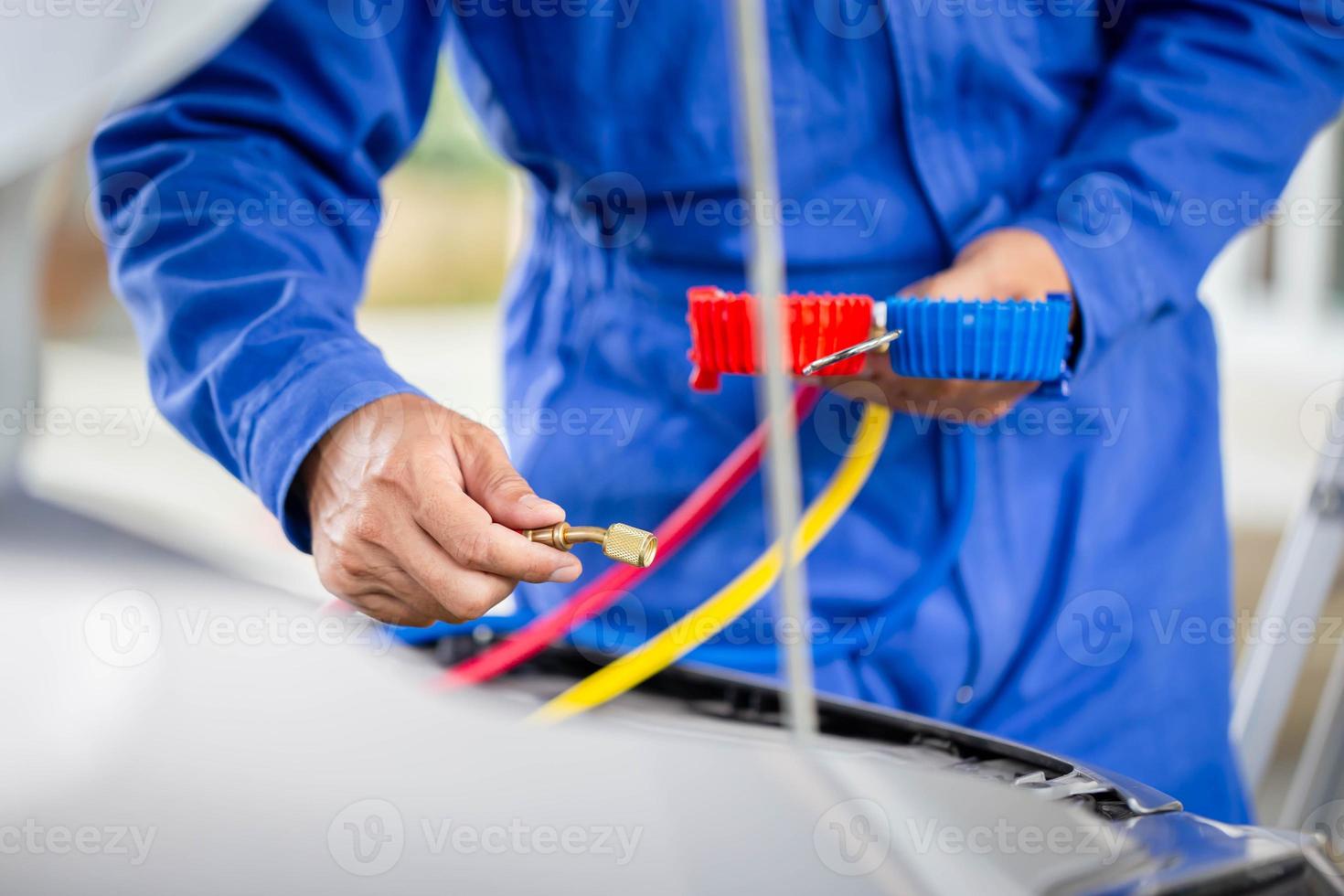 Technician check car air conditioning system refrigerant recharge
