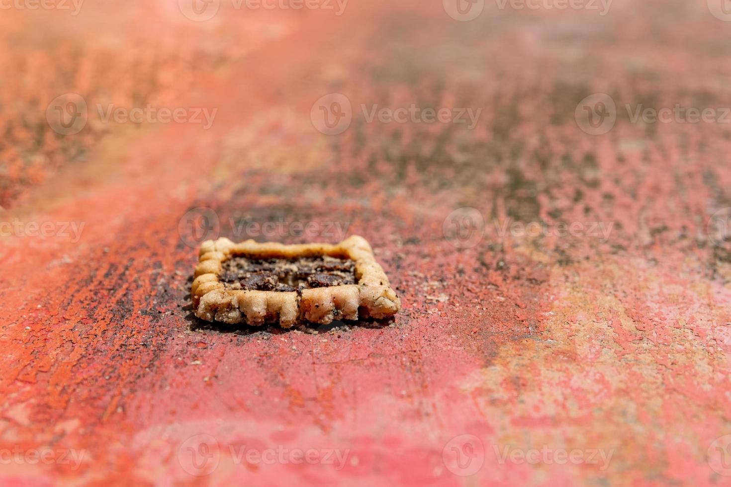 old biscuit on rusty metal photo