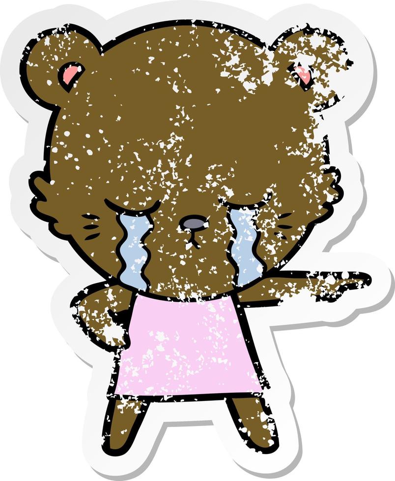 distressed sticker of a crying cartoon bear in dress pointing vector