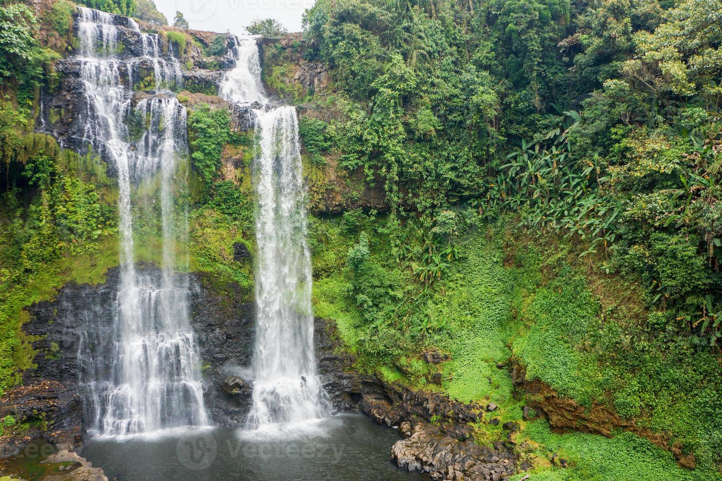 streaming line waterfall from high mountain in Laos photo