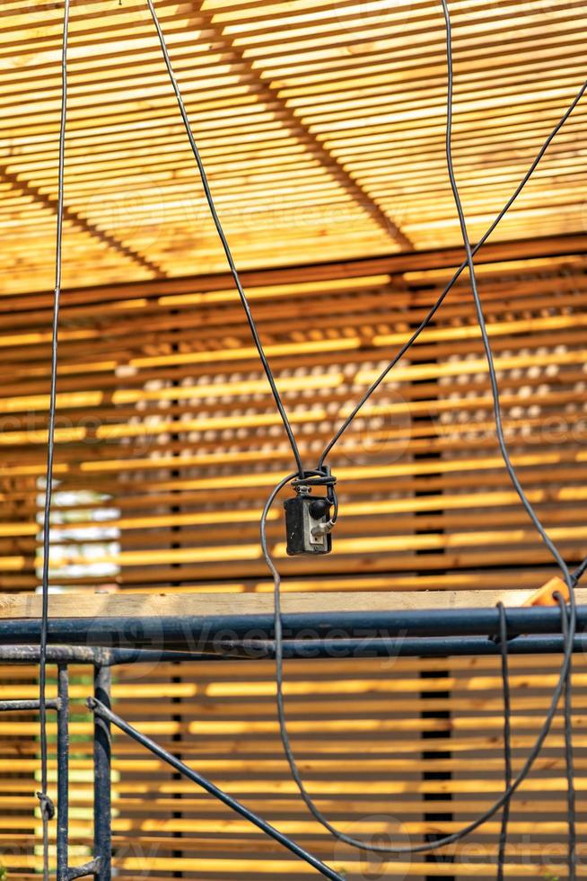 The constructor sets the power plug and electric cable connects together by hanging top of the floor to avoid from walking away. photo