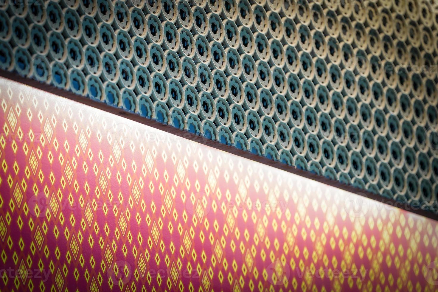 Bounced light inside graved dark green Thai pattern craft, bright out to the diamond shape on rose pink thai pattern style. photo