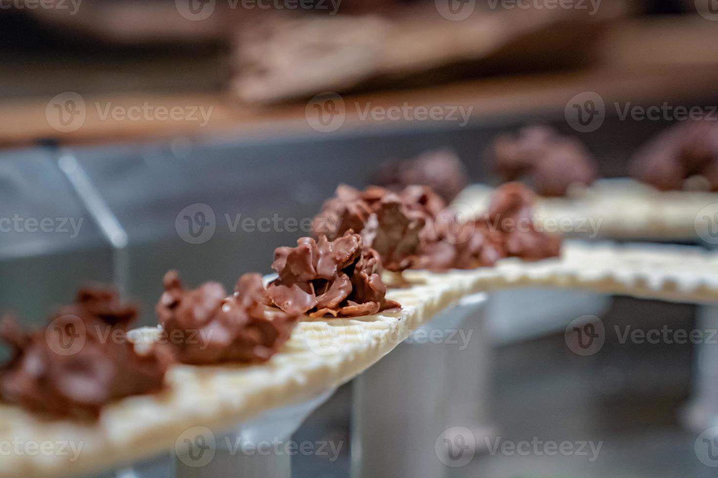 close up cereals corn flake cover with dark chocolate and arrange on the tower waffle sky line. photo