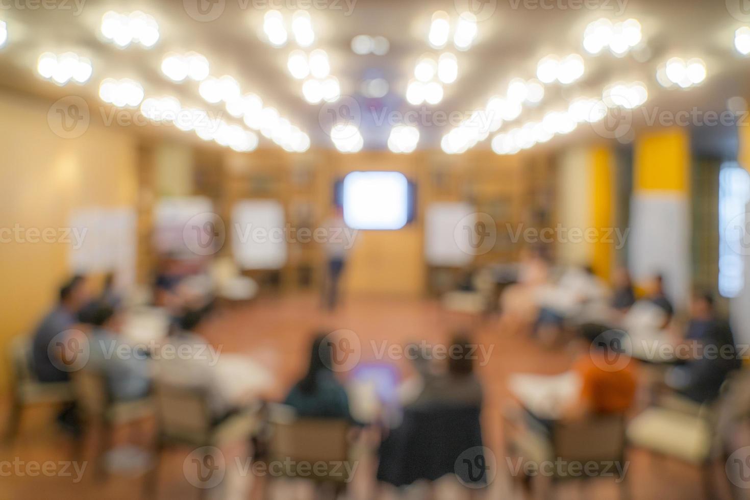 Blurry Asian people sit in round for meeting and share experience. photo