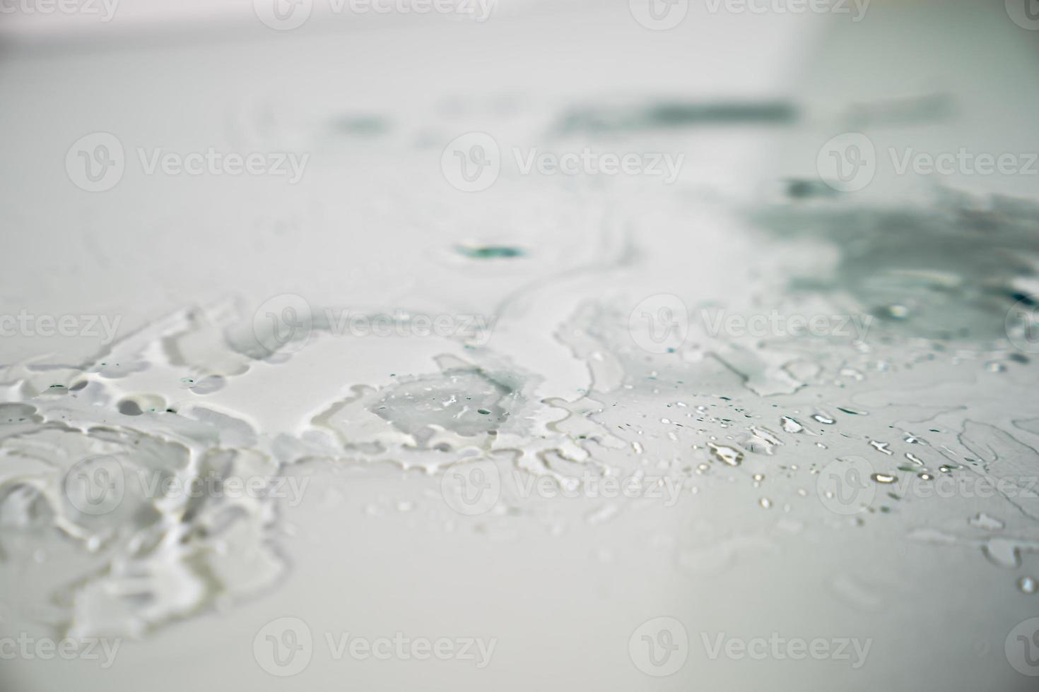 water splashes reflex on the flat glass floor photo