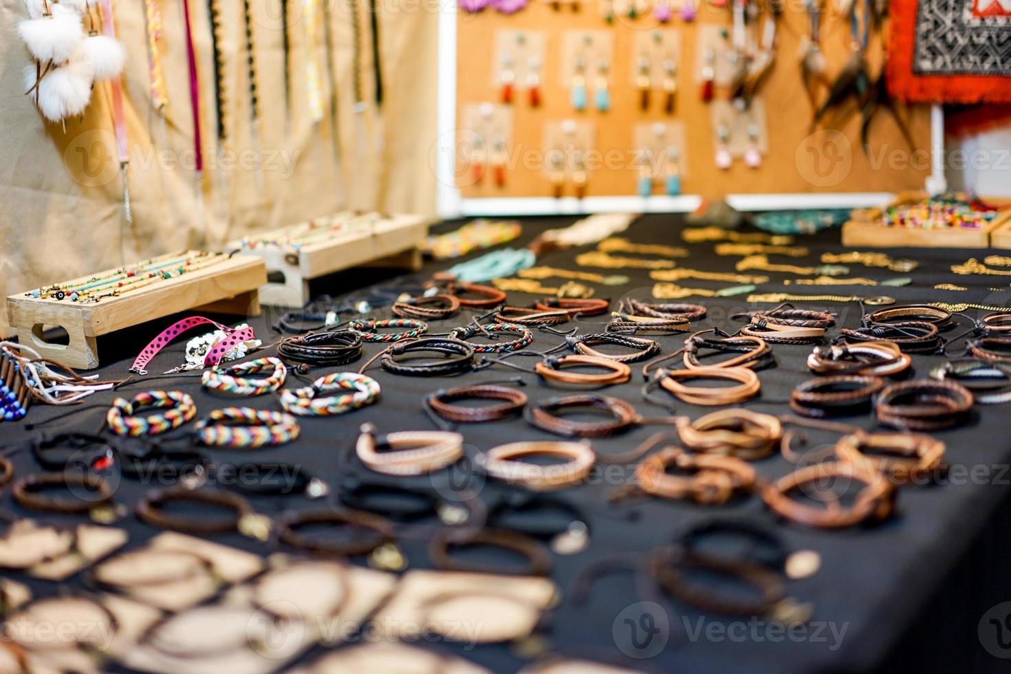 several leather bracelets are arranged on the display for sales photo