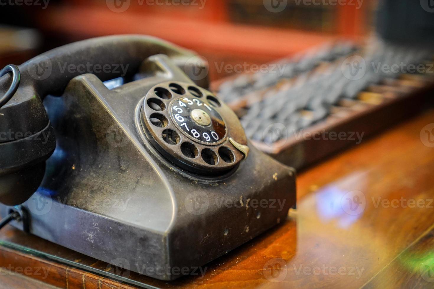 Vintage steel telephone on the wood tabel. photo