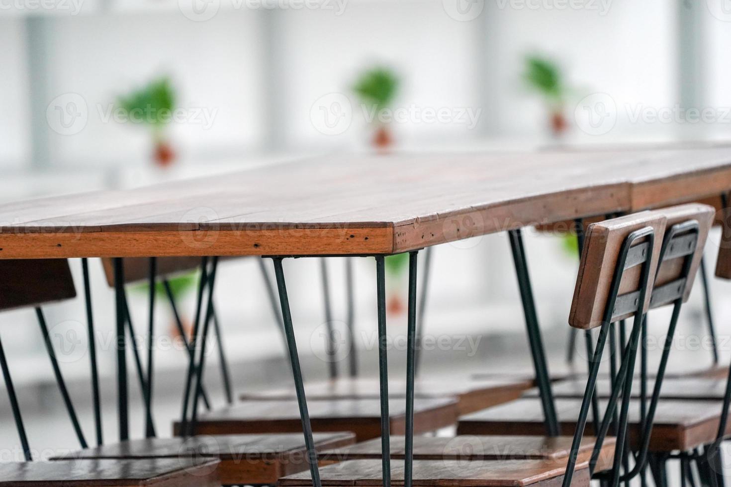 Closeup corner vintage dark wooden table. photo