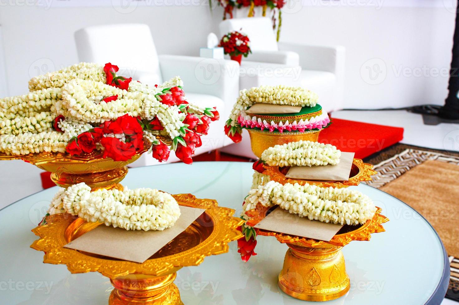 Garland on the Phan Thai traditional up step dish on the table and letter card, prepare for ceremony and event. photo