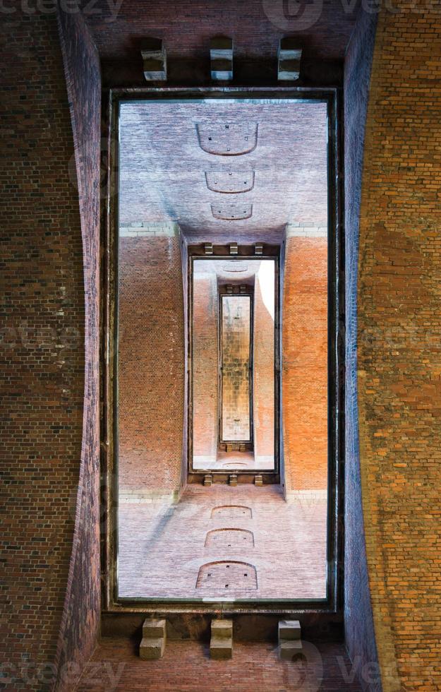 View through brick portal with open doorways photo
