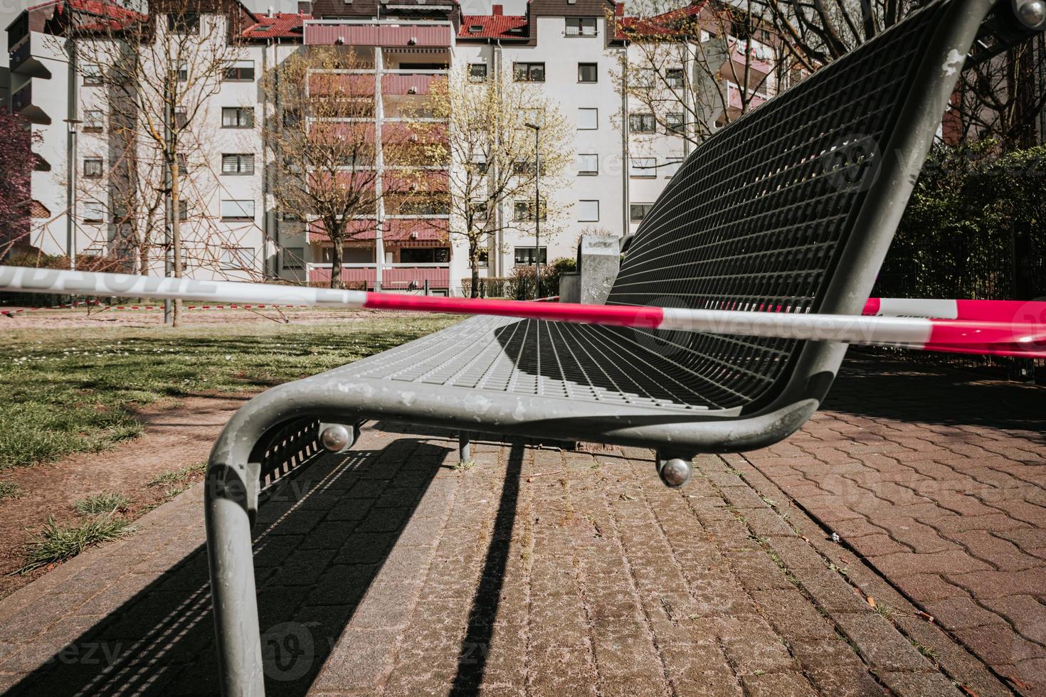 a restricted zone due to the coronoa virus on a playground with benches photo