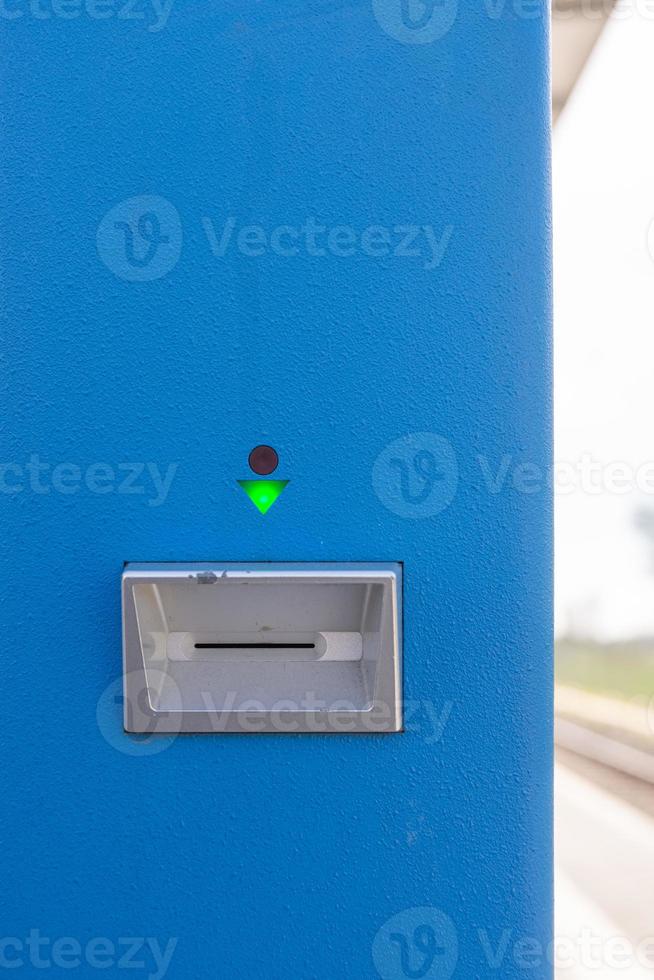 Electronic card slot in a machine with green light photo