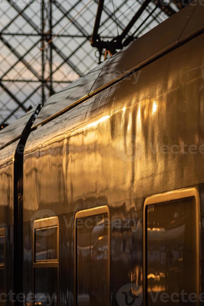 Passenger train in a covered station terminal photo