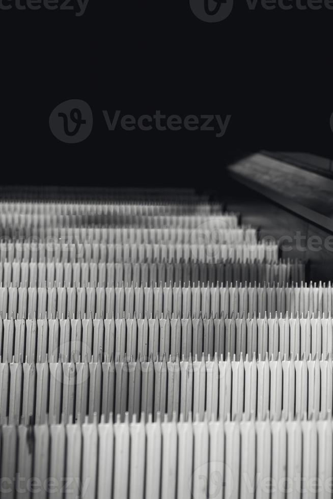escalator in black and white shot photo