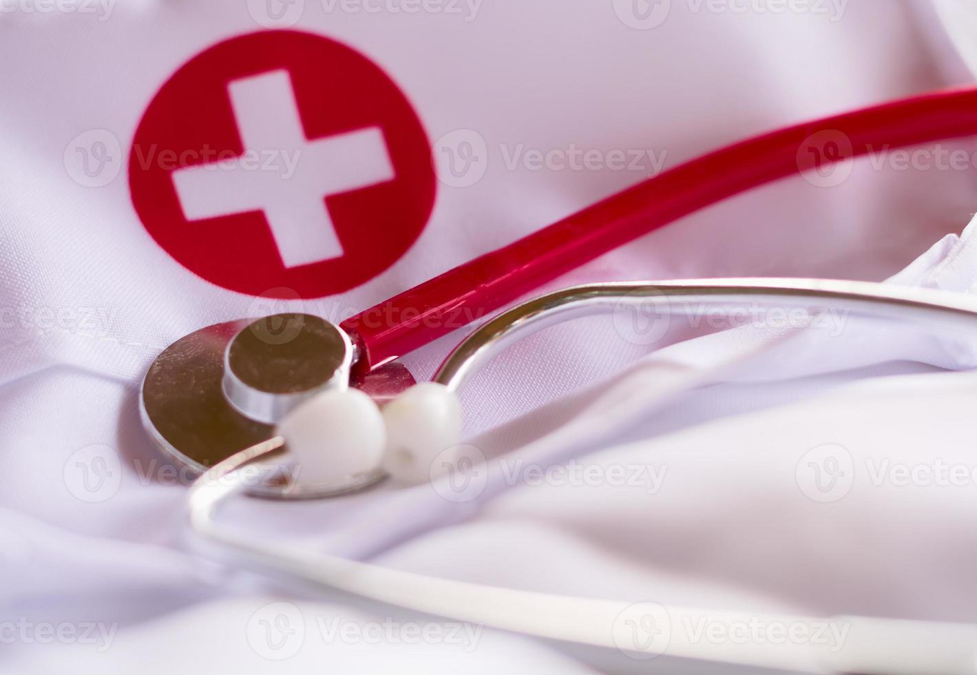 red stethoscope on a lab coat photo