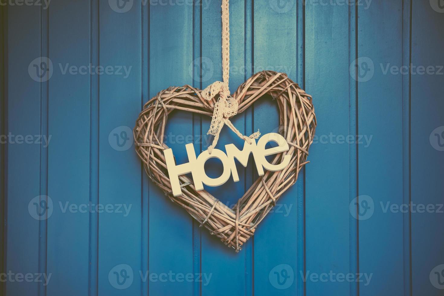 a heart decoration on a wooden wall photo