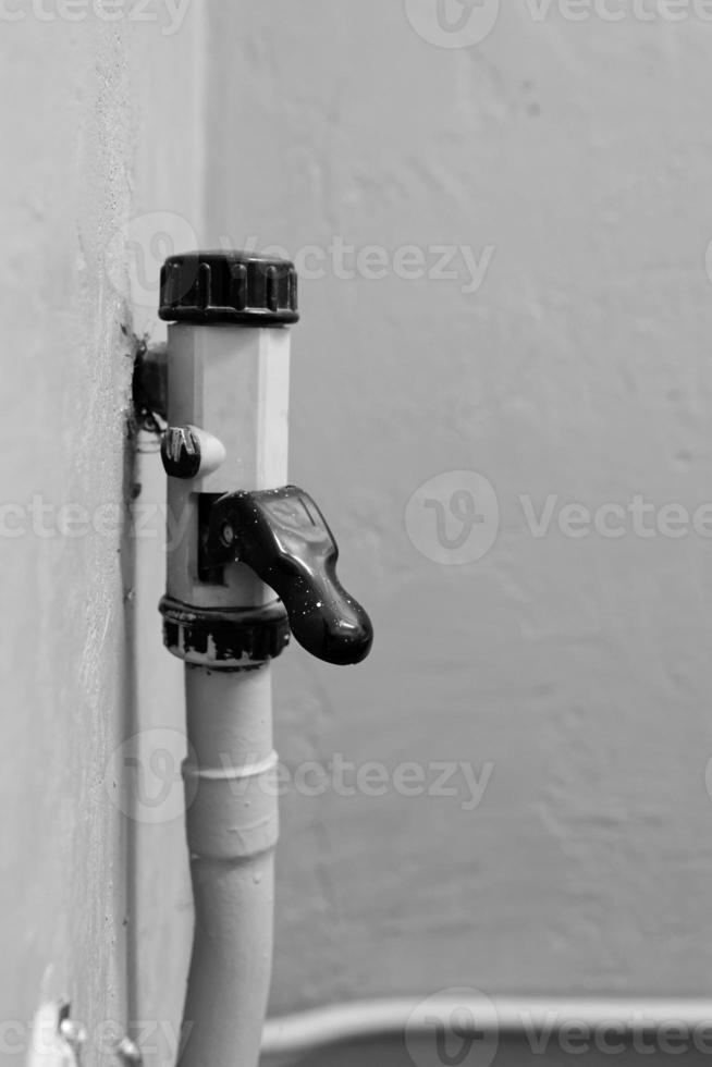 Flow control lever on an old water pipe photo