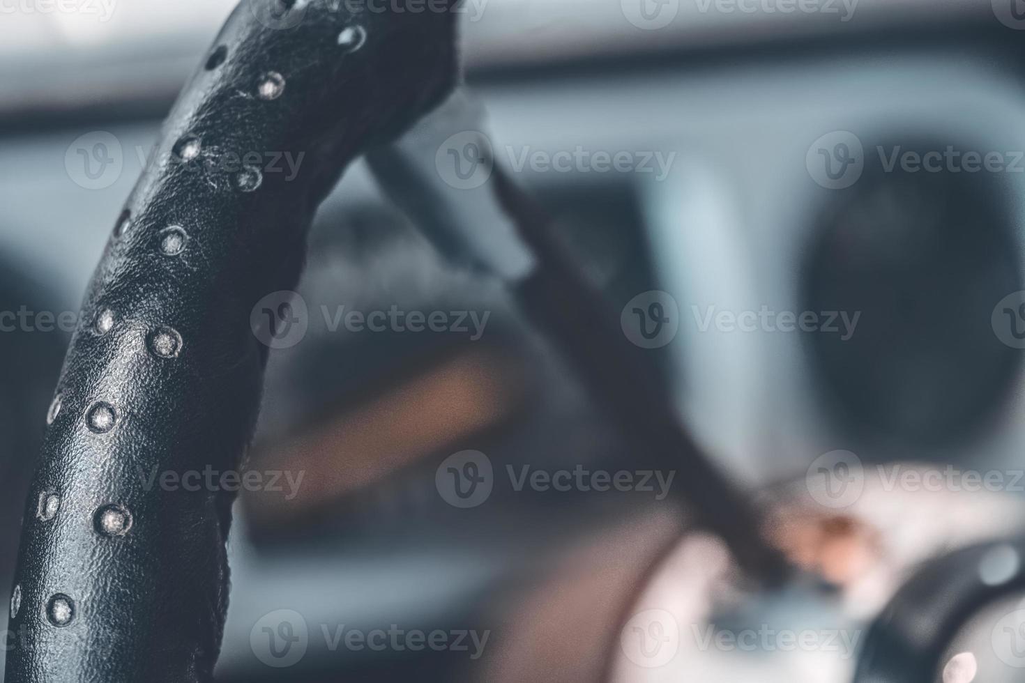 an old car steering wheel in close-up photo