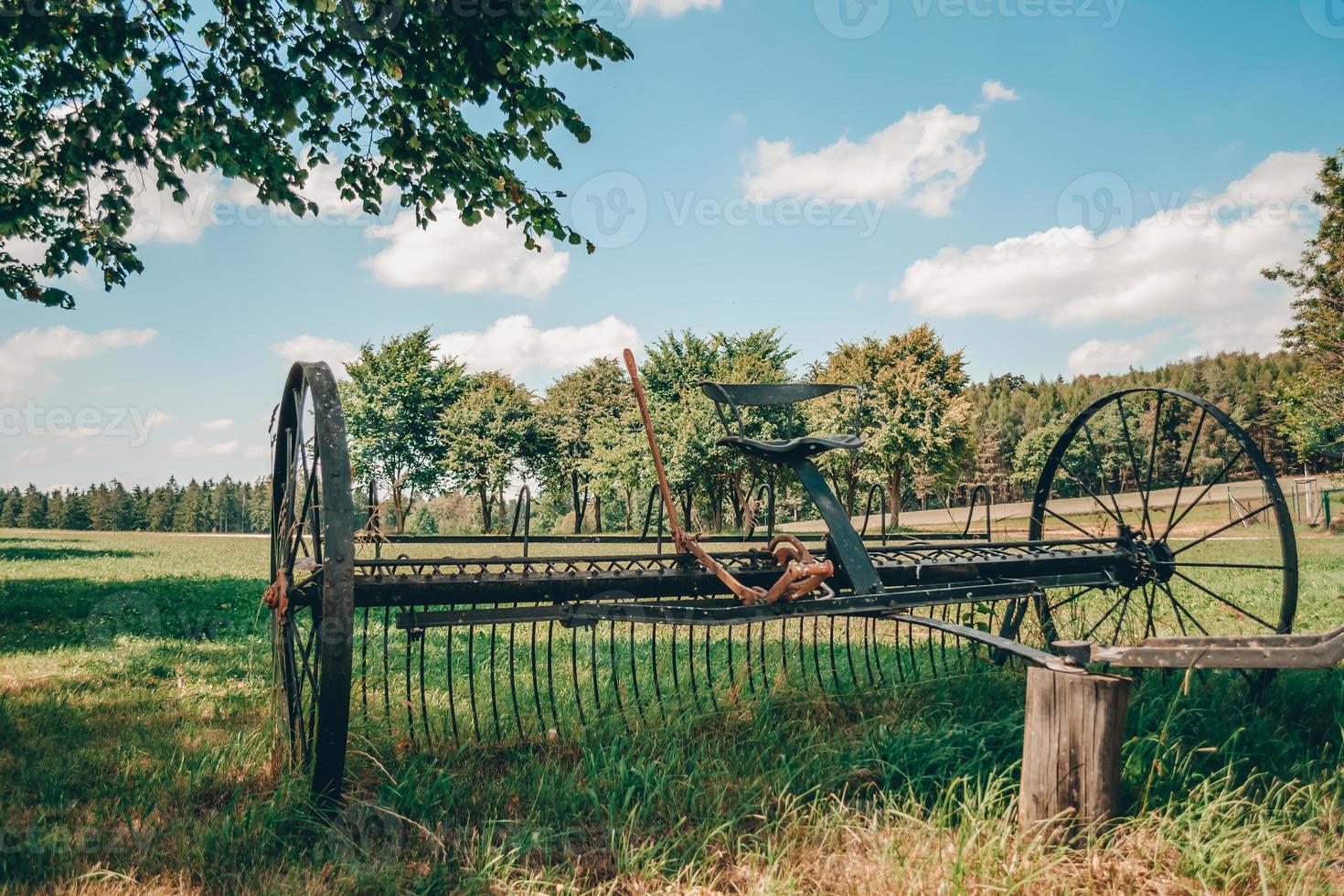 An old horse plow trailer with seat photo